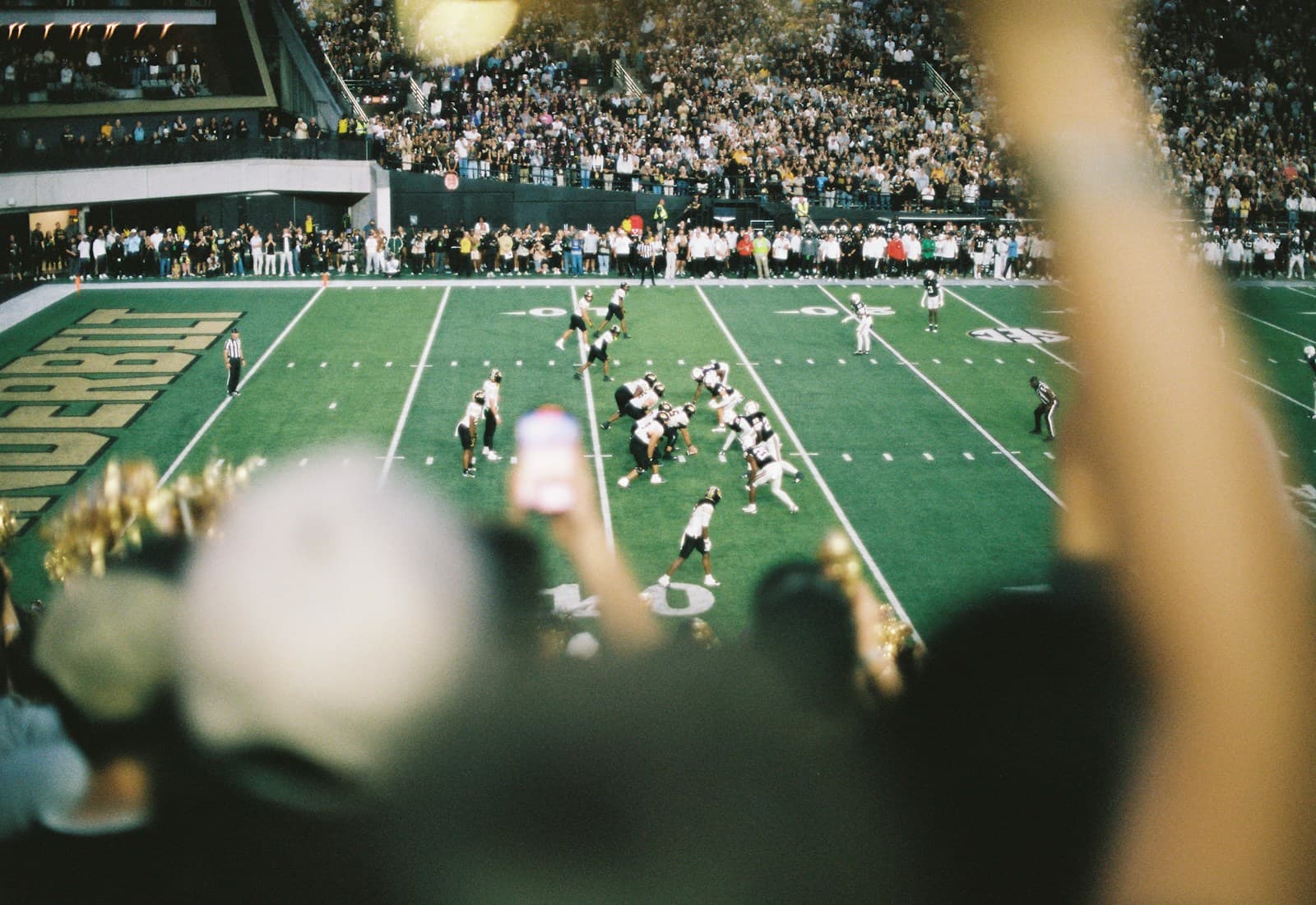 American football game in a stadium